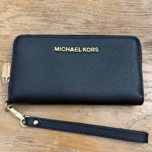 Michael Kors Black Zip-Around Wristlet with Gold Hardware.